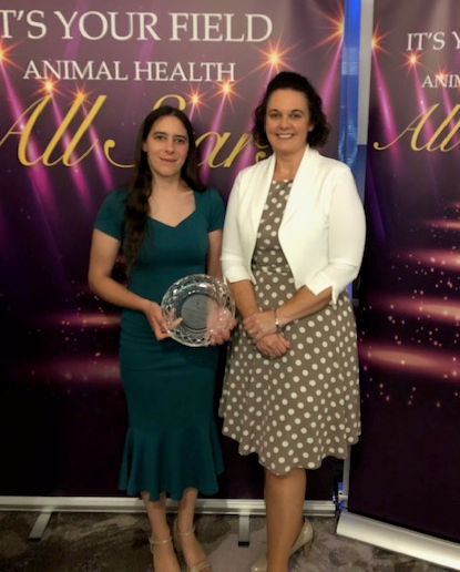 Lindsey Edwards holding an Animal Health All Stars award